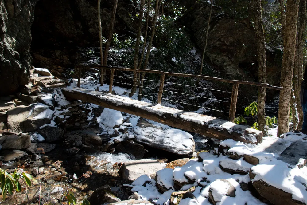 snow covered bridge on Alum Cave Trail in winter